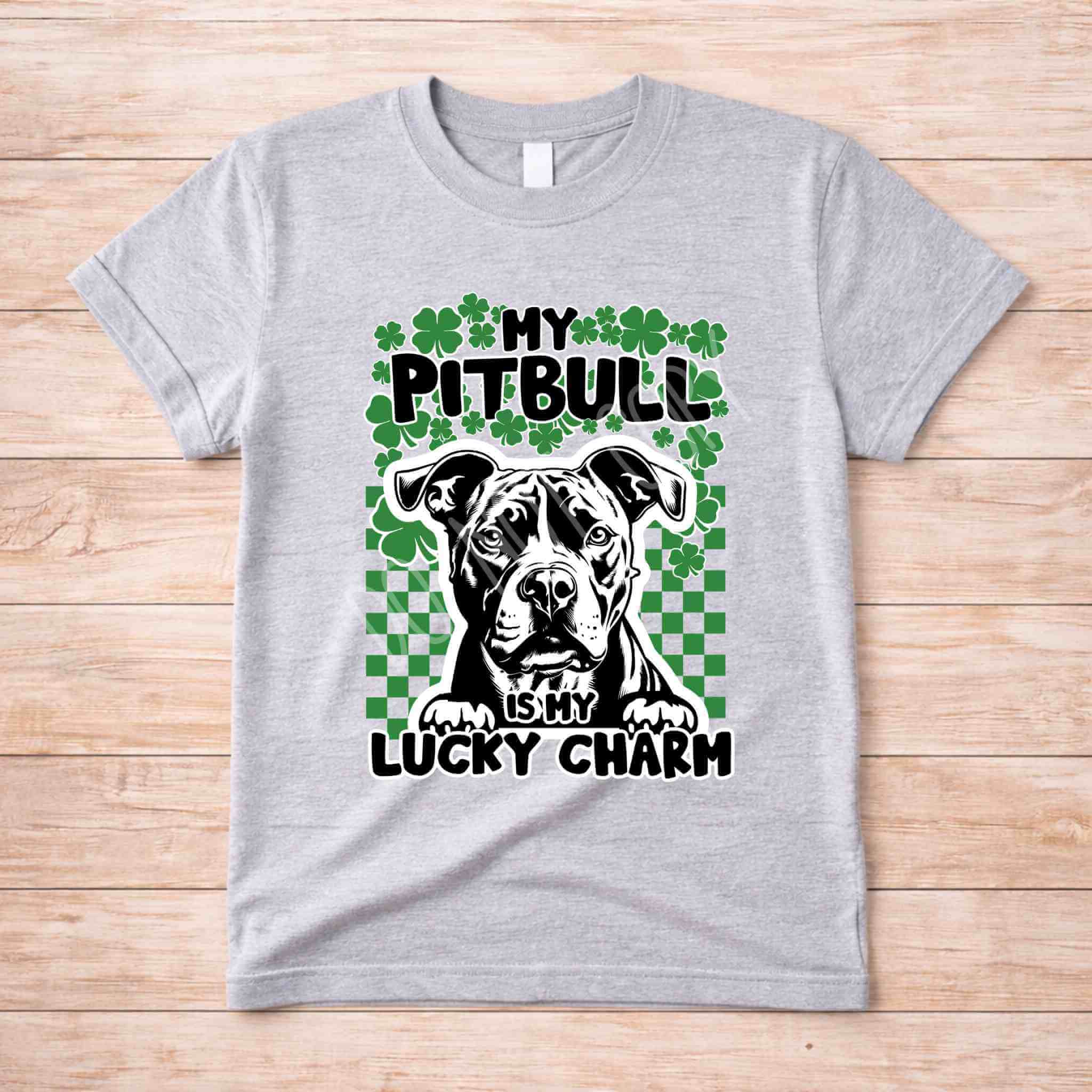 St Patricks Day dog lover shirt featuring a Pit Bull with the phrase 'My Pit Bull Is My Lucky Charm' on a gray tee.