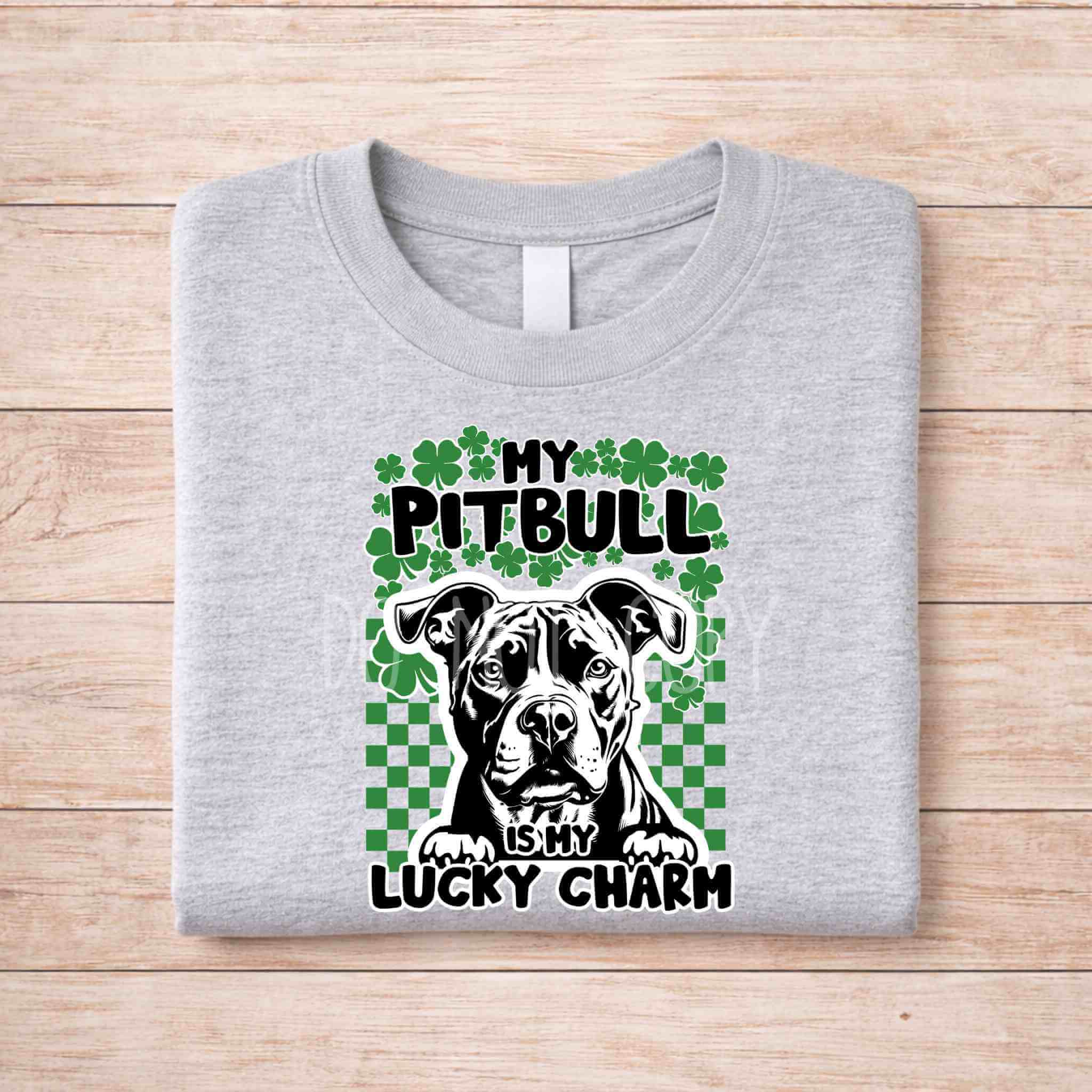St Patricks Day dog lover shirt featuring a Pitbull with the text 'My Pitbull Is My Lucky Charm' on a grey t-shirt.