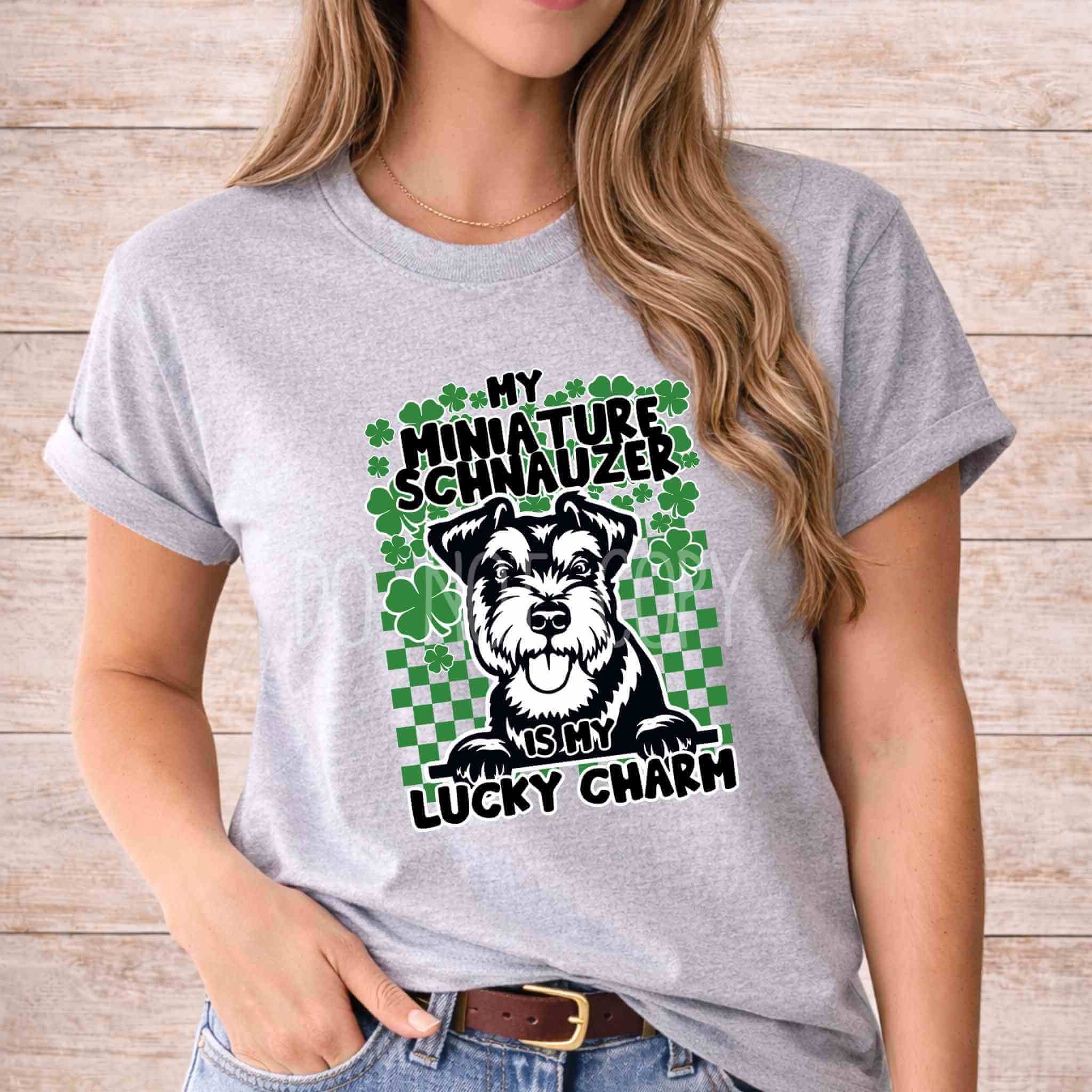 St Patricks Day dog lover shirt featuring a Schnauzer graphic and the phrase 'My Miniature Schnauzer Is My Lucky Charm'.