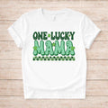 St. Patricks Day One Lucky Mama t-shirt with retro green lettering and shamrock accents on a white fabric.