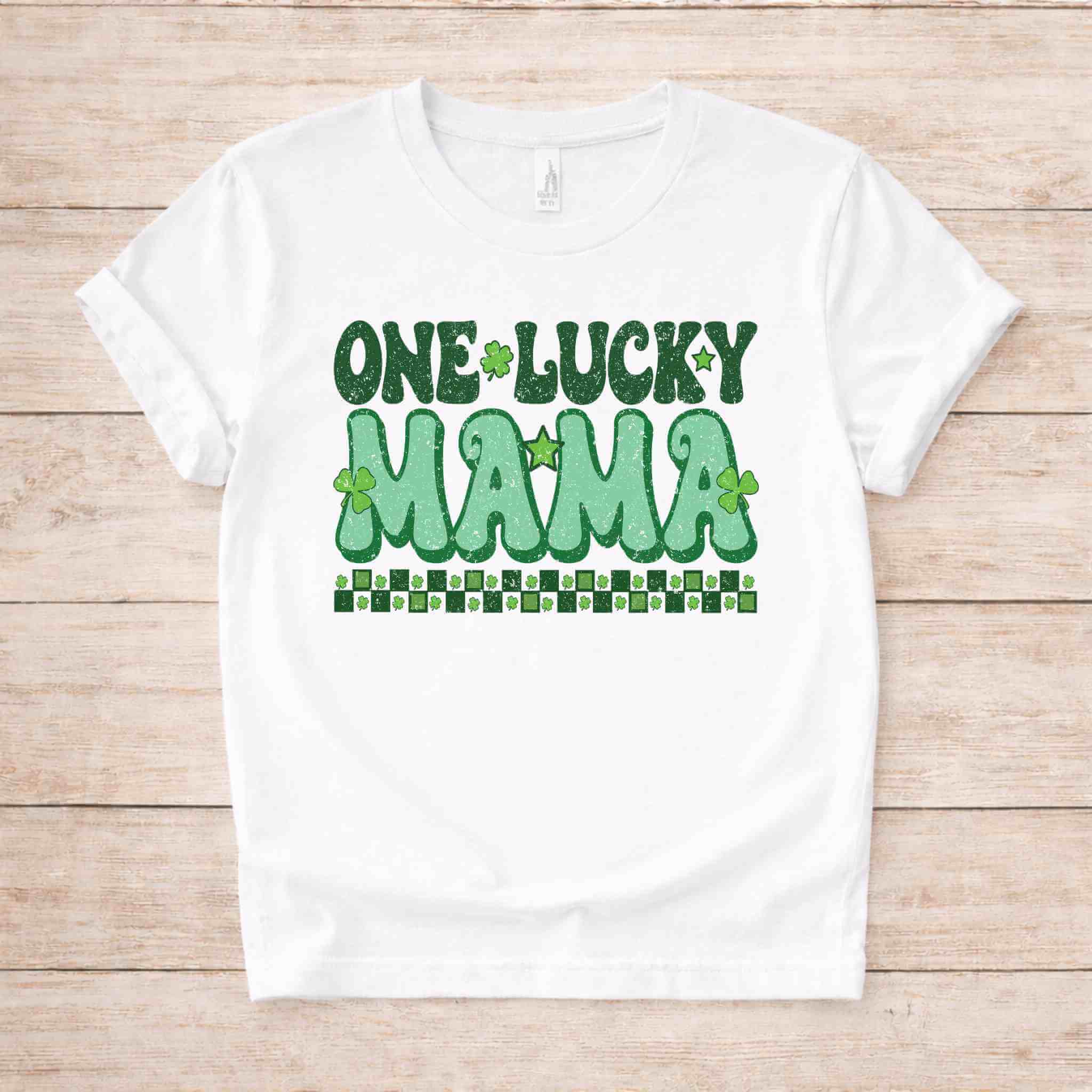 St. Patricks Day One Lucky Mama t-shirt with retro green lettering and shamrock accents on a white fabric.