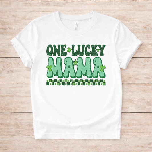 St. Patricks Day One Lucky Mama t-shirt with retro green lettering and shamrock accents on a white fabric.
