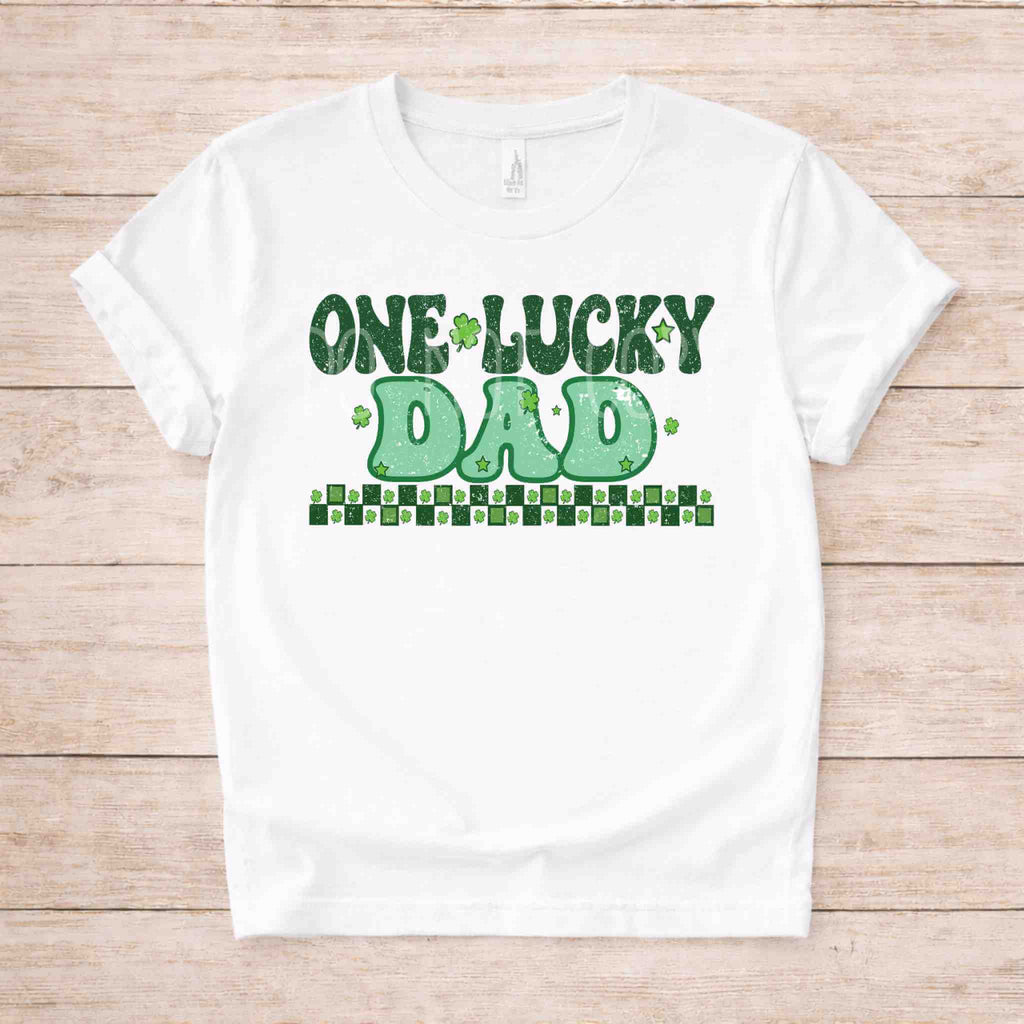 St. Patricks Day One Lucky Dad shirt with retro-inspired green lettering and shamrock accents on a white tee.