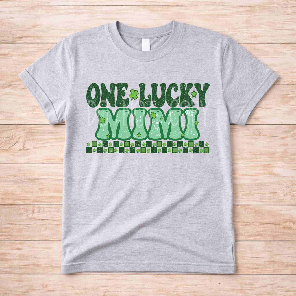 St. Patricks Day One Lucky MUM tee shirt with retro lettering and shamrock accents on a gray background.