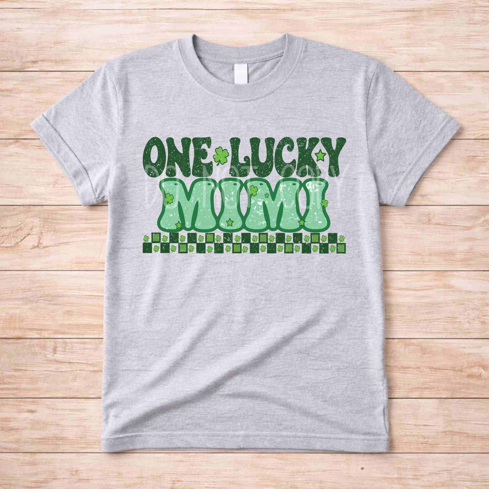 St. Patricks Day One Lucky MUM tee shirt with retro lettering and shamrock accents on a gray background.