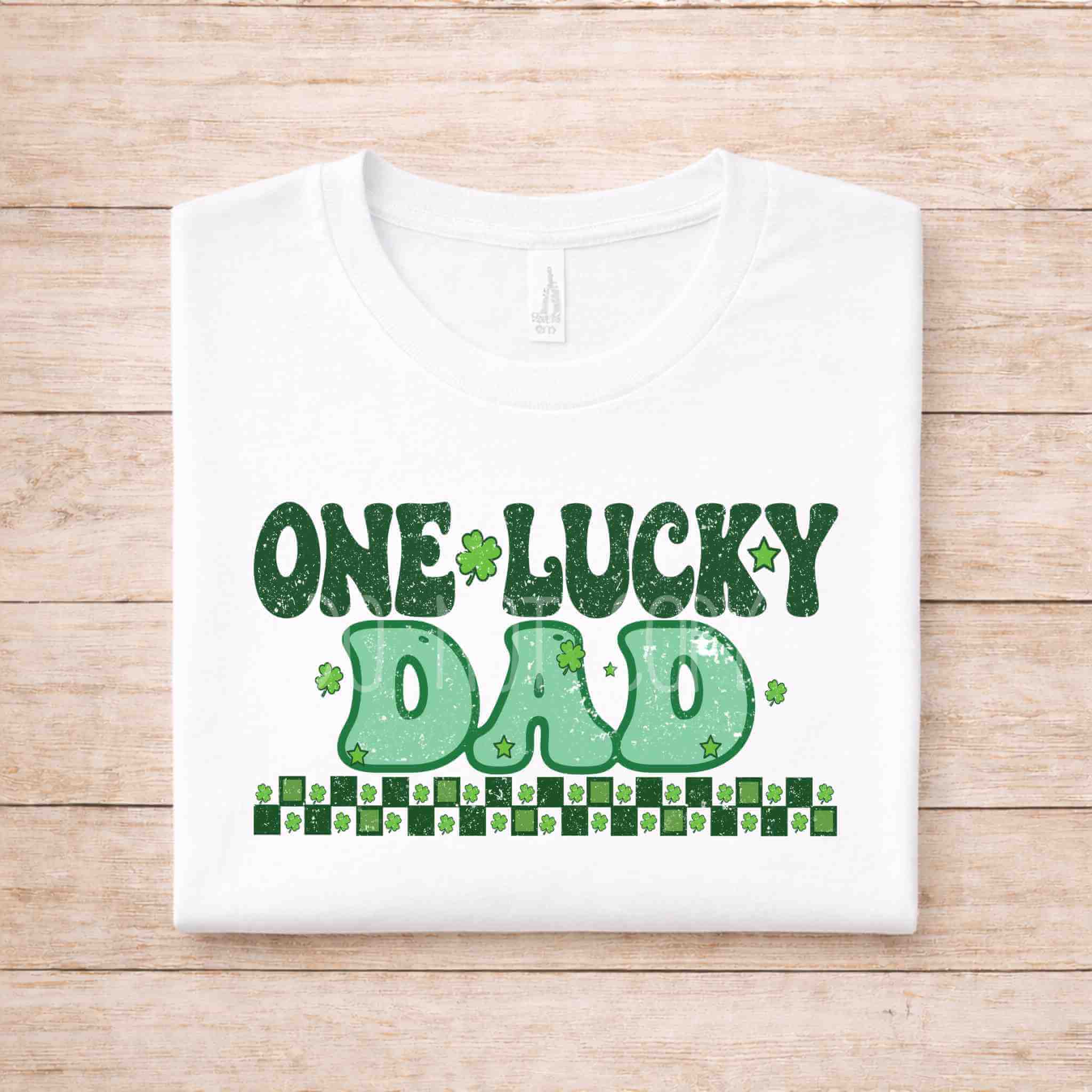 St. Patricks Day One Lucky Dad tee with festive green lettering and shamrock accents