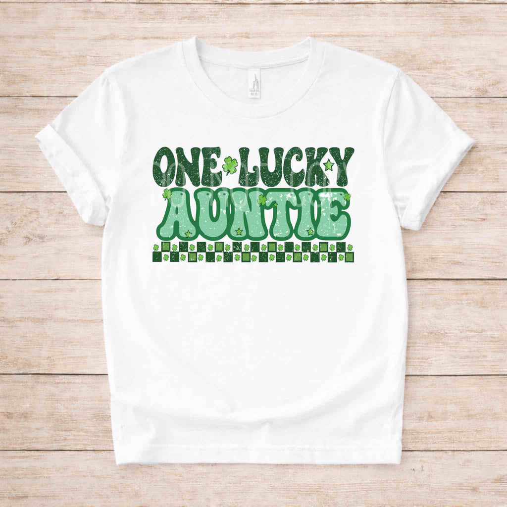 St. Patricks Day One Lucky Auntie tee shirt with green shamrock accents on a white background.