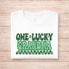 St. Patricks Day matching tee for grandma featuring retro green lettering and shamrock accents on a white shirt.