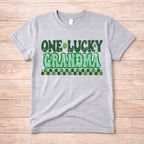 St. Patricks Day matching tee shirt featuring retro green lettering saying One Lucky Grandma.