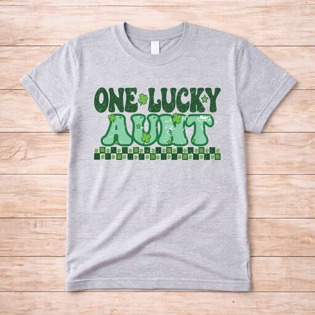St. Patricks Day One Lucky Aunt T-shirt featuring retro lettering and shamrock accents.
