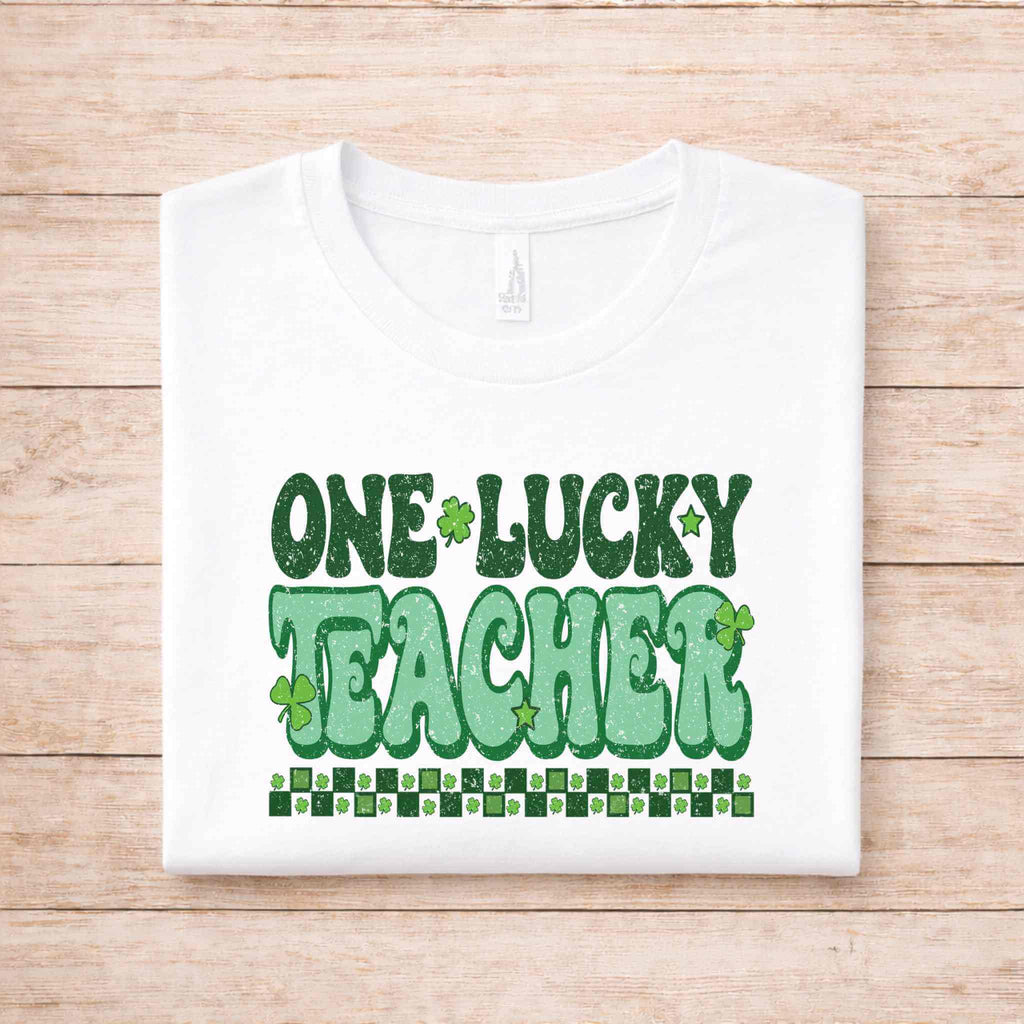 St. Patricks Day Teacher T-Shirt with bold green 'One Lucky Teacher' graphic design on a white tee.