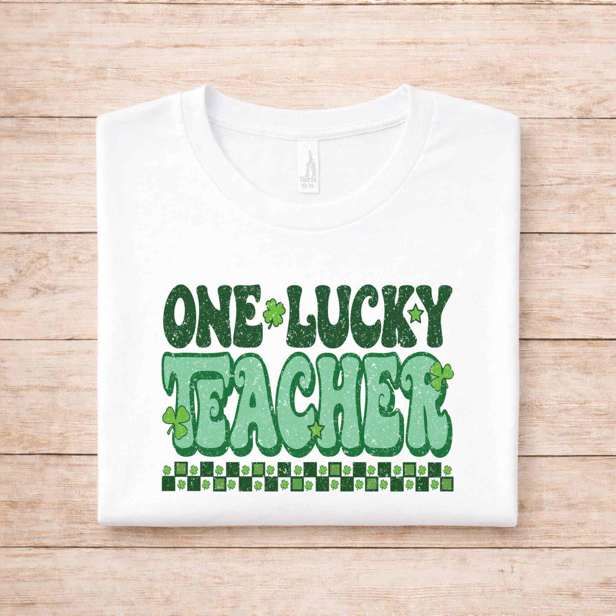 St. Patricks Day Teacher T-Shirt with bold green 'One Lucky Teacher' graphic design on a white tee.