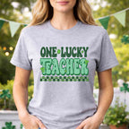St. Patricks Day Teacher T-Shirt featuring a cute shamrock graphic and retro lettering for festive classroom style.
