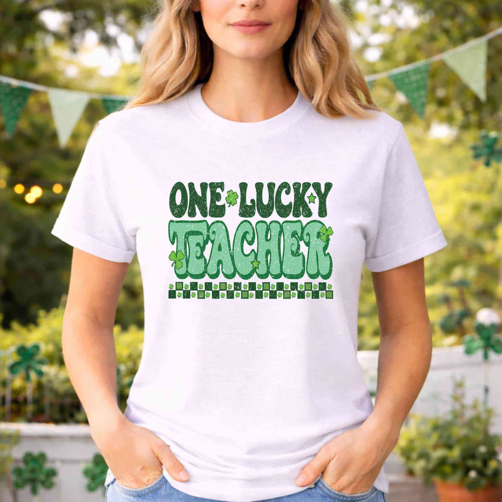 St. Patricks Day Teacher T-Shirt featuring "One Lucky Teacher" shamrock graphic in bold green lettering.