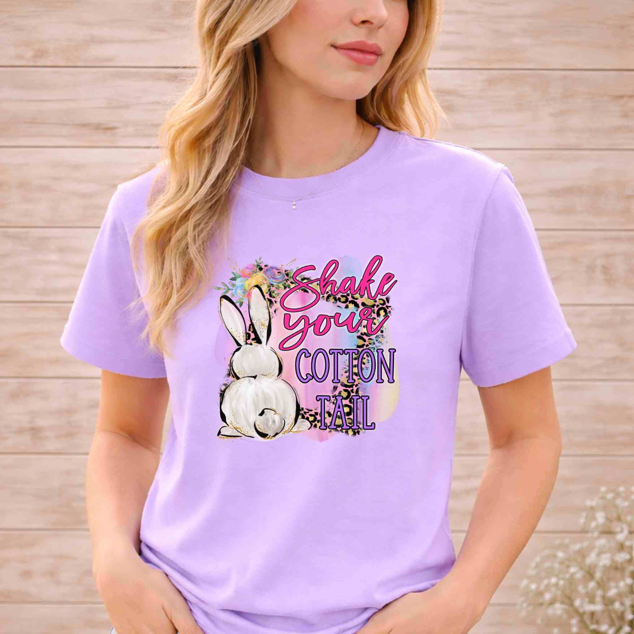 Shake Your Cotton Tail Easter shirt featuring a rabbit graphic in pastel colors, perfect for a fun and festive look. Funny Easter graphic tee.