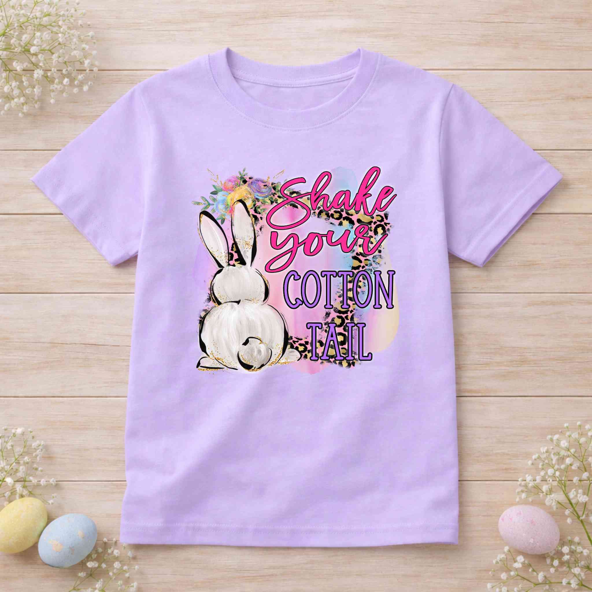 Shake your Cotton Tail Easter shirt featuring a funny bunny graphic on a lavender tee.