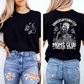 A woman wears the Undercaffeinated Moms Club Shirt by Becca's Banging Designs LLC—a black women’s tee with a coffee cup and butterflies on the front and a skeleton mom holding coffee on the back, perfect for tired moms.